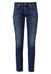 Jeans de denim azul oscuro con corte slim, que cuentan con cinco bolsillos, herrajes de cobre y un leve desgaste a lo largo de los muslos. Diseño clásico.