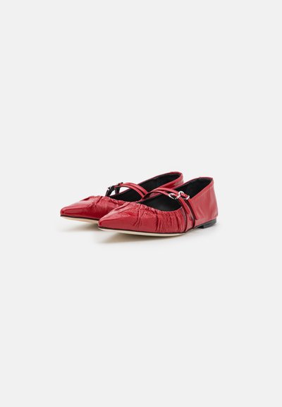 Red flat shoes with a pointed toe, made from shiny textured material, featuring crinkled accents and a black interior.