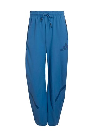 Pantalones deportivos azules hechos de tela ligera, con una cintura elástica con cordón y patrones de acento negro en los costados.