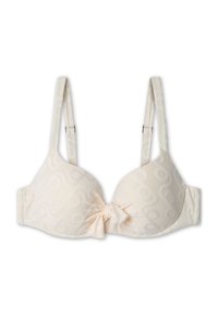 Sottile reggiseno beige chiaro in tessuto morbido e testurizzato, caratterizzato da un motivo delicato. Presenta un dettaglio a fiocco al centro e spalline regolabili.
