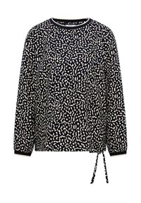 Blouse à manches longues noir et blanc avec un motif de taches abstraites et un détail noué sur le côté à l'ourlet.