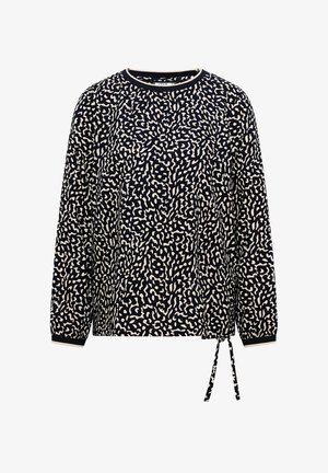 Czarna i biała bluzka z długim rękawem w abstrakcyjne plamy, z wiązaniem po bokach u dołu.