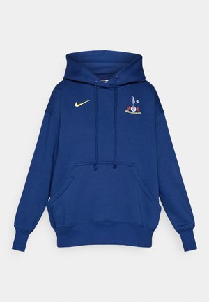 Navy blue hooded sweatshirt made of cotton, featuring a front pocket and a yellow Nike logo. Includes an embroidered team crest on the chest.