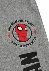 Gray fabric features a circular graphic of a red spider character with text: "WITH GREAT POWER COMES GREAT RESPONSIBILITY." Black accents below.