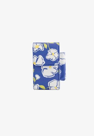 Blue floral wallet with white flowers and green leaves, textured leather, fold-over flap, and visible stitching details.