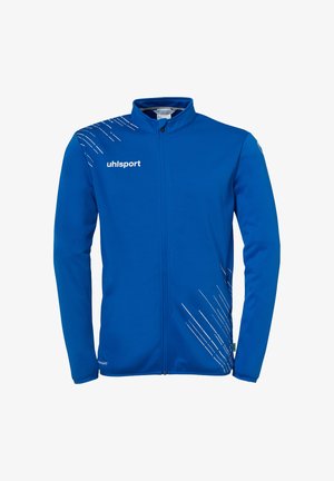 Blauwe sportjack met een volledige rits, zachte stof en witte diagonale lijnen aan de linkerkant; voorzien van het uhlsport logo op de borst.