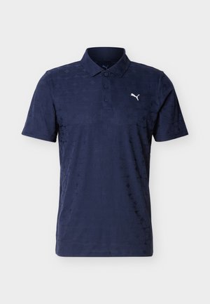 Polo bleu marine à manches courtes avec col, trois boutons, motif géométrique subtil et logo Puma blanc sur la poitrine gauche.