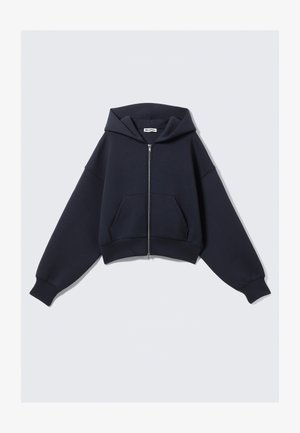 Black zip-up hoodie with front pockets and a wide hood, laid flat with long sleeves extended against a plain light background.