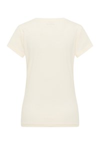 Cream-colored t-shirt with short sleeves, round neckline, and a smooth cotton texture. Simple design, no visible patterns or graphics.