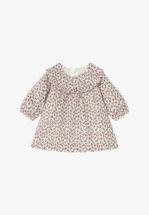 Vestido floral de algodón blanco, con escote con volantes, mangas largas y un estampado de pequeñas hojas rojas y verdes en toda la prenda.