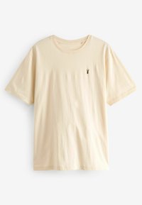 Kortærmet cremefarvet t-shirt lavet af blødt stof, med et lille broderet logo på venstre bryst og rund halsudskæring.