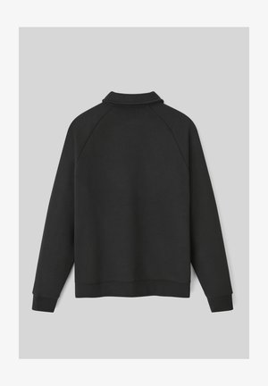 Sweatshirt noir à manches longues avec un col, des poignets et un ourlet côtelés, vu de dos sur un fond gris uni.