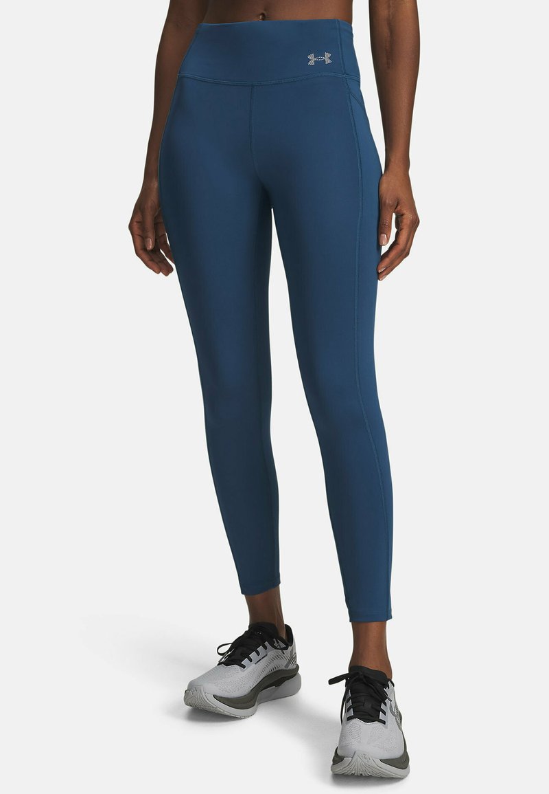 Leggings met hoge taille en compressie, gemaakt van een diepblauwe stof met een gladde textuur. Voorzien van contrasterende stiklijnen en een logo-accent.