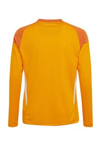Lange mouw shirt in feloranje met witte zijpanelen en een ronde hals. Gemaakt van glad, lichtgewicht materiaal met een relaxte pasvorm.
