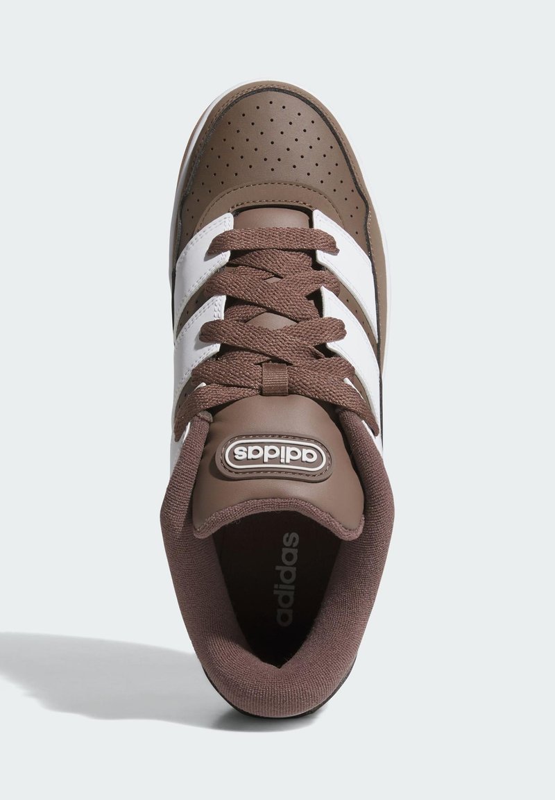 Brown sneaker with white stripes, made of synthetic material. Features perforated upper, textured laces, and padded collar.