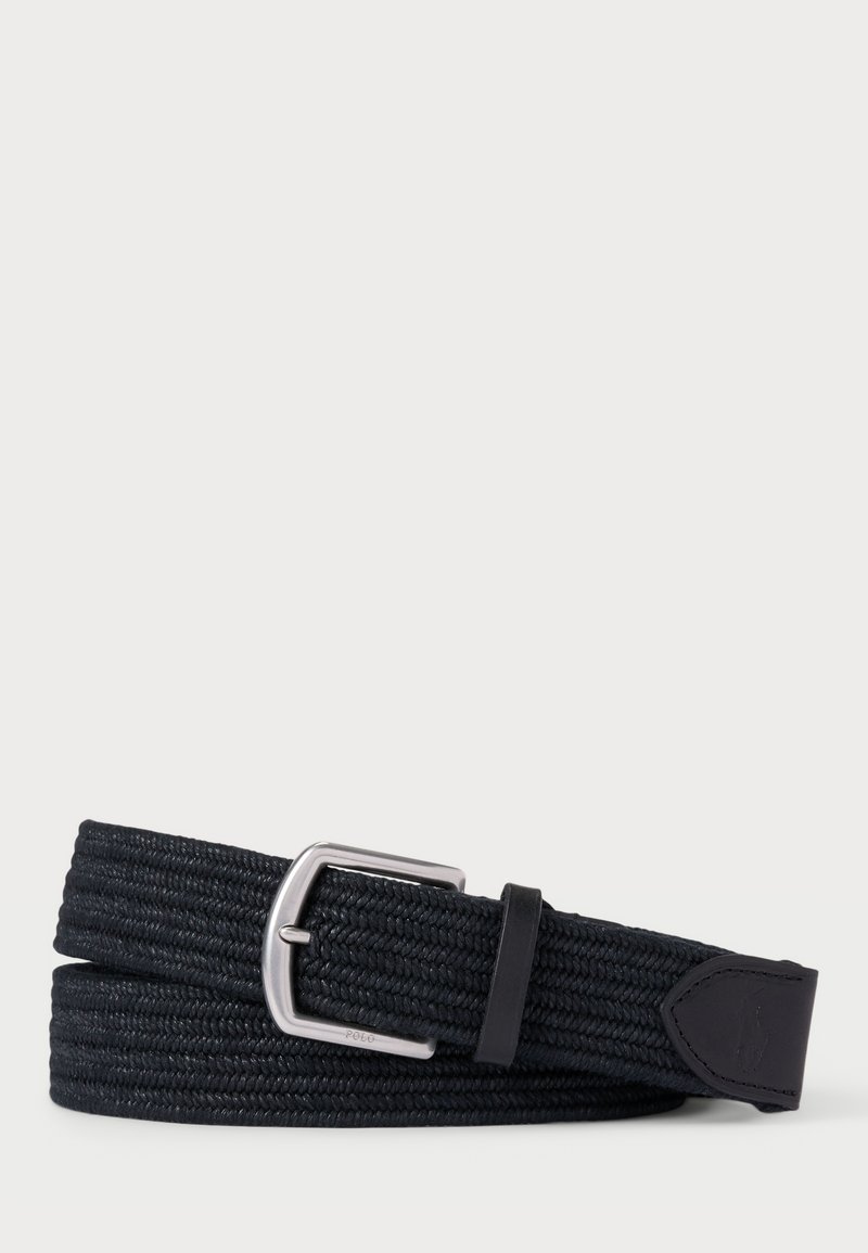 Curea țesută neagră cu cataramă metalică argintie, având un material texturat și un accent din piele la capăt. Design flexibil și ajustabil.