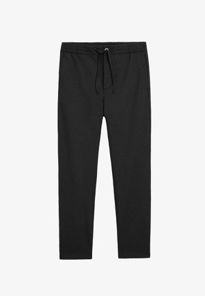 Sorte bomulds joggerbukser med elastisk talje og snøre, med sidelommer og tapered ben design. Glat tekstur.