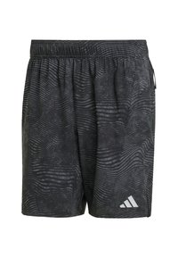 Crne atletske kratke hlače s elastičnim pojasom, koje imaju teksturirani valoviti uzorak i reflektirajući detalj loga na donjoj lijevoj strani.