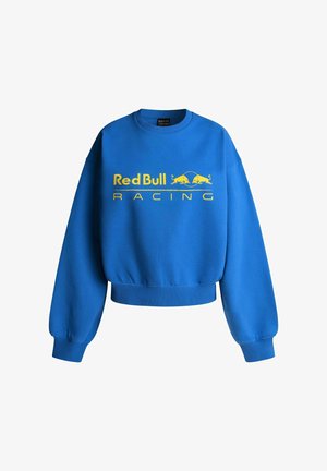 Blå sweatshirt med ribbede halsudskæring og manchetter, udstyret med et stort gult "Red Bull RACING" logo og to stiliserede røde tyre.