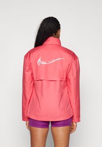 Nike Performance FAST - Windbreaker - aster pink