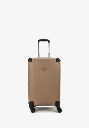 Compact beige hard-shell suitcase with embossed pattern, retractable handle, four black wheels, and brand logo on front center.
