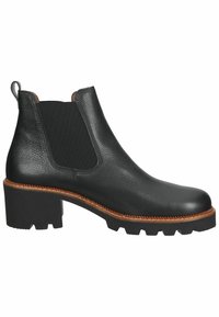 Botín Chelsea de cuero negro, con paneles laterales elásticos, suela de goma gruesa y costuras en contraste. Punta redondeada y tirador en la parte trasera.