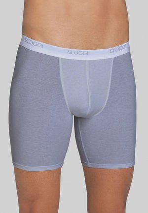 Boxer da uomo SLOGGI grigio chiaro con una cintura bianca. Realizzati in tessuto morbido e elastico, con una superficie liscia e un design aderente.