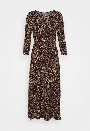 Vestido de manga larga negro con patrones en espiral dorados y color óxido. La tela tiene una textura suave y el diseño permite una silueta ajustada.