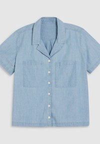 Light blue short-sleeved shirt made of a soft fabric, featuring a collar, two chest pockets, and button closures along the front.