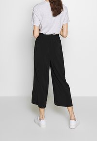 mbyM Tygbyxor - black