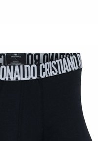 Boxer in cotone neri con una ampia cintura elastica che presenta la scritta "CRISTIANO RONALDO" in grassetto bianco. Tessuto morbido con una superficie liscia.