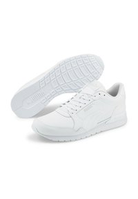 Scarpe da ginnastica bianche con tomaia sintetica liscia, punta rotonda, design con lacci e suola in gomma texturizzata con un branding discreto.