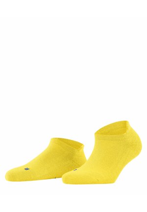 Gelbe Knöchelstrümpfe aus weichem, strukturiertem Material. Verfügt über eine enge Passform, gerippten Bund und ein blaues Logo-Detail in der Nähe der Zehen.