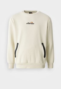 Kremowy sweatshirt z okrągłym dekoltem, elastycznymi mankietami, bocznymi zamkami i logo z czerwonymi, żółtymi i czarnymi akcentami.