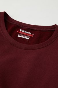 Burgunderfarbene Kaschmir-Thermoshirt mit Rundhalsausschnitt, weicher Textur und Etikett mit "INTIMISSIMI UOMO" und Größe L.