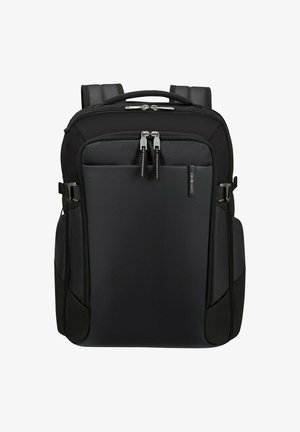 Zaino Samsonite nero con spallacci imbottiti, due compartimenti principali con zip e tasche laterali, mostrato su uno sfondo bianco.
