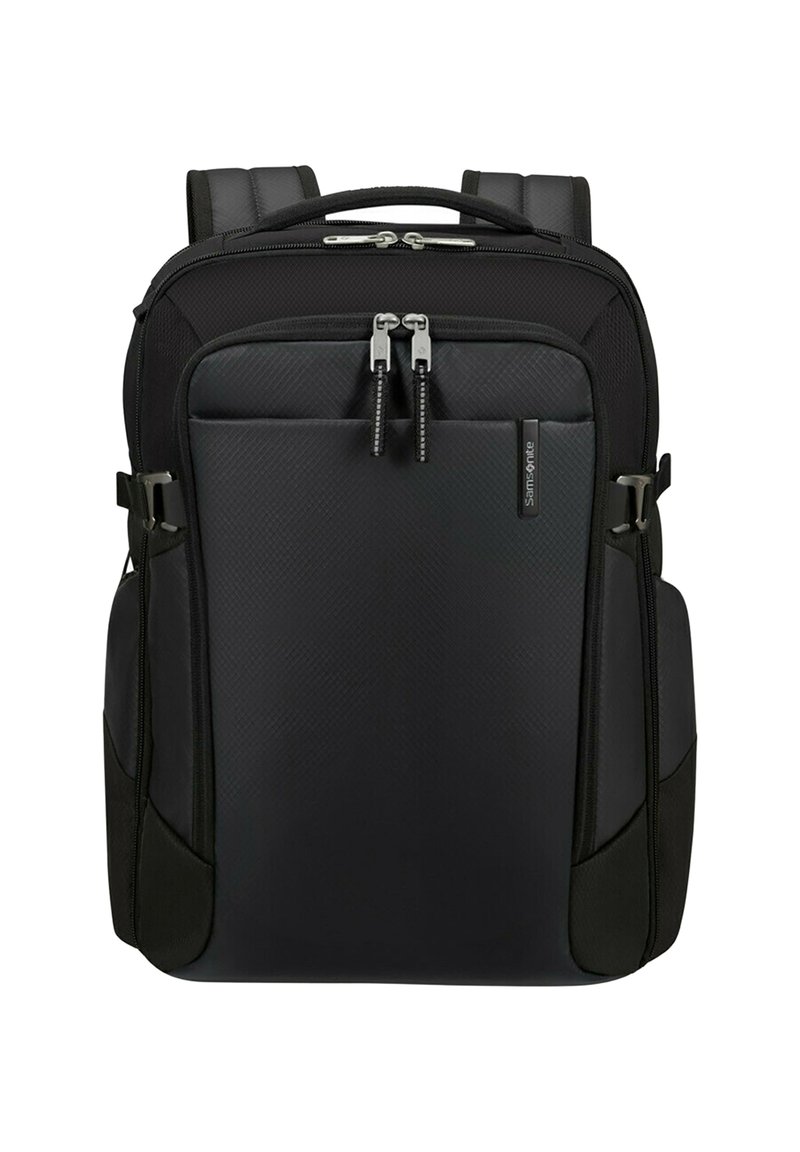 Mochila negra Samsonite con correas acolchadas, dos compartimentos principales con cremallera y bolsillos laterales, mostrada sobre un fondo blanco.