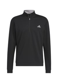 Pull noir à manches longues avec fermeture éclair quart de zip, col montant et petit petit logo gris sur la poitrine gauche.