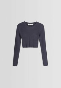 Top corto a costine navy con maniche lunghe, caratterizzato da un colletto rotondo e dettagli strutturati sul davanti. Tessuto in cotone ed elastico.