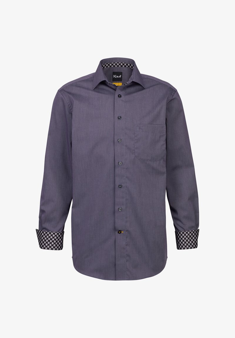 Camicia a maniche lunghe con bottoni di colore viola scuro e strisce verticali chiare, bottoni neri e polsini decorati. Presenta una tasca sul petto.