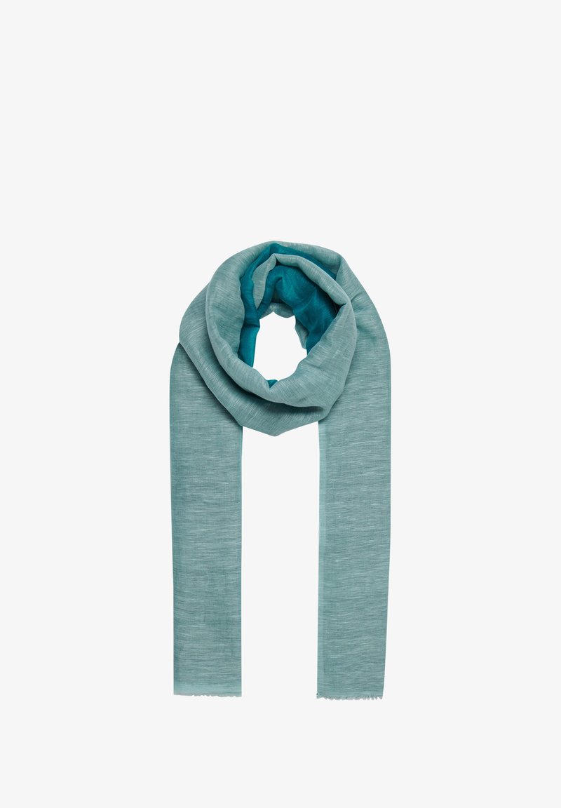 Écharpe légère et texturée dans un dégradé de teal. Se distingue par un matériau doux qui tombe bien, avec des bords effilochés et une doublure intérieure lisse.