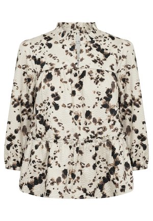 Blusa a maniche lunghe color crema con macchie astratte nere e marroni. Presenta un colletto arricciato e un orlo arricciato per una vestibilità rilassata.