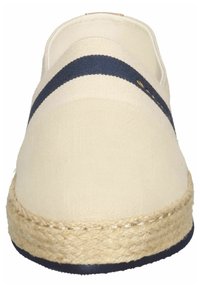 Beige canvas espadrillos med rundad tå och snördetaljer. Har ett marint randigt accent och sula av jute rep.