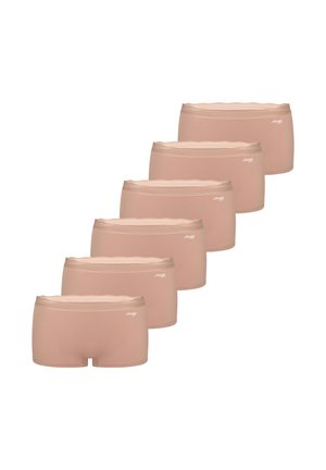 Six shortys beige pour femmes, sans coutures, disposés en rangée diagonale avec un petit logo blanc sur la ceinture.