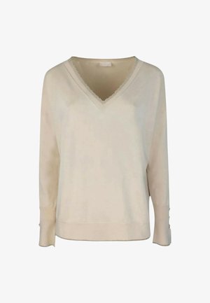 Maglione lungo a maniche con colletto a V e bordo in pizzo di colore crema. Presenta una vestibilità comoda e polsini con bottoni per un tocco di dettagli. Texture in maglia morbida.