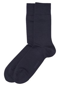 Marineblaue Socken aus einem glatten, strukturierten Material. Mit einem gerippten Bund und verstärktem Zeh, mit einem Logo, das nah am Zeh aufgedruckt ist.