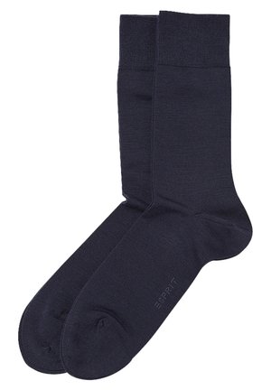 Marineblaue Socken aus einem glatten, strukturierten Material. Mit einem gerippten Bund und verstärktem Zeh, mit einem Logo, das nah am Zeh aufgedruckt ist.