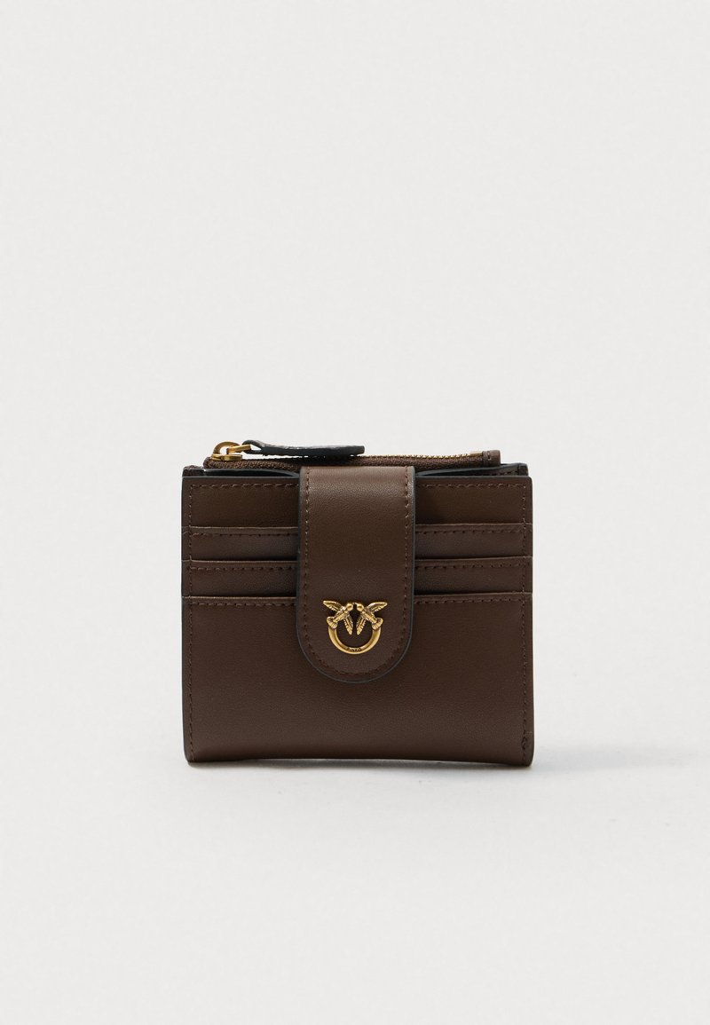 Brown leather wallet with a flap closure, card slots, and a gold logo accent, featuring a smooth texture and compact rectangular shape.