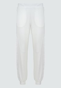 Witte joggerbroeken met elastische tailleband, zijzakken en ribbels bij de boorden. Gladde stof met een iets losse pasvorm en gebogen stikdetails.
