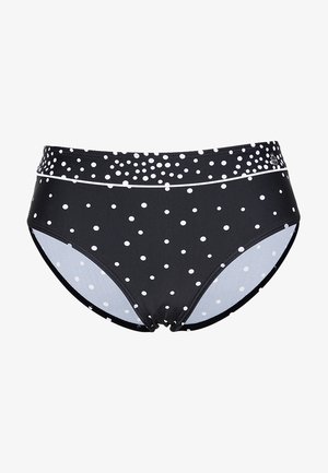 Black swim bottoms with white polka dots, high-waisted design, smooth texture, and contrasting solid lining. Features a subtle white accent band.